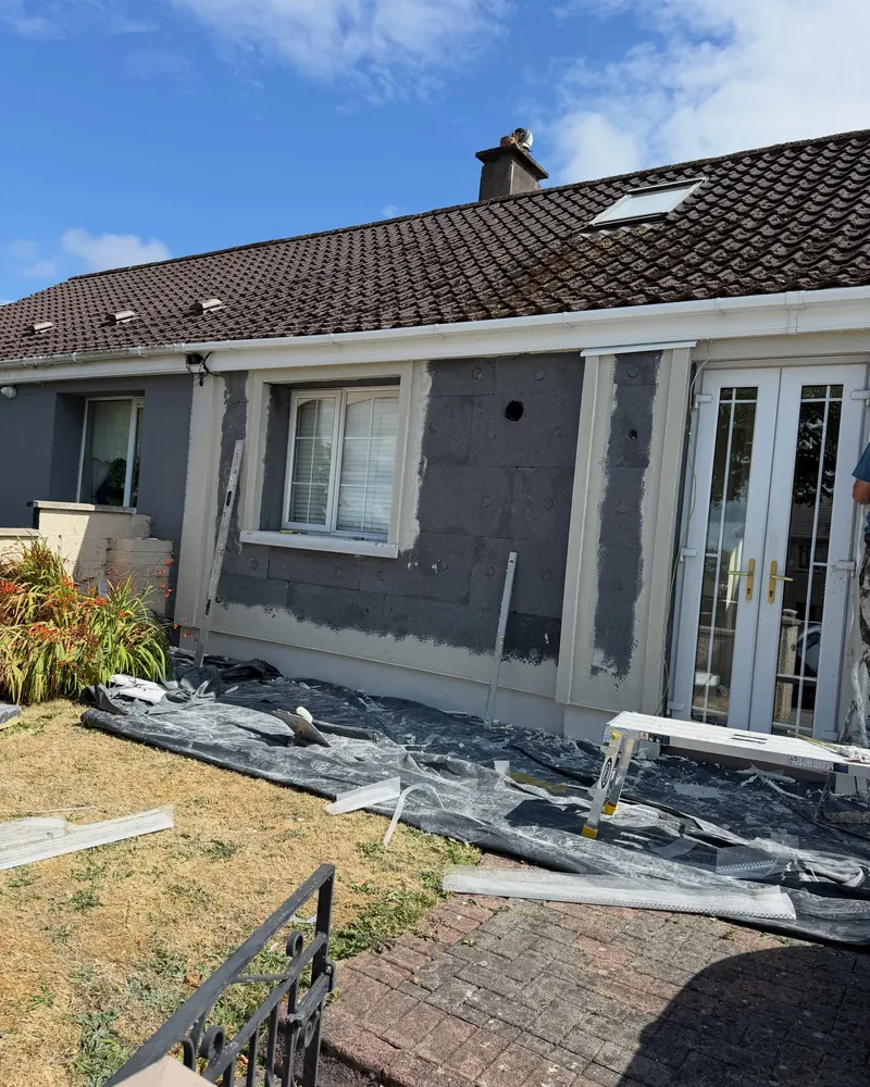 Boards on around the french doors, sheeting down on the lawn